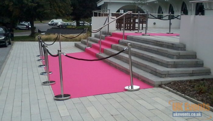 pink vip carpet hired for a masion house to go outside and down some stairs